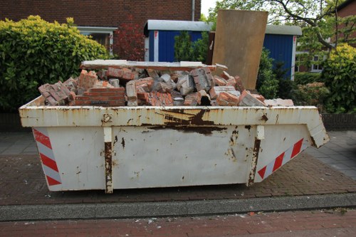 Workers and trucks at a waste removal depot in Blackheath