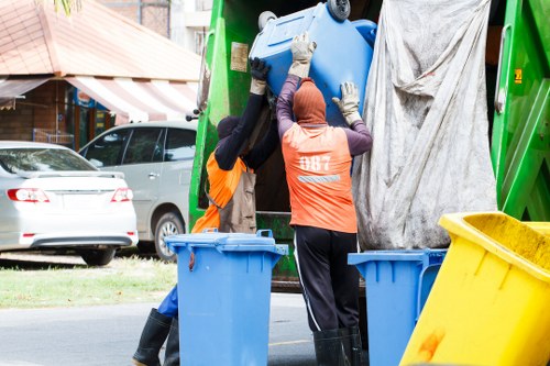 Technicians managing electronic waste disposal