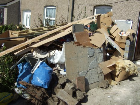 Efficient garden clearance process in progress